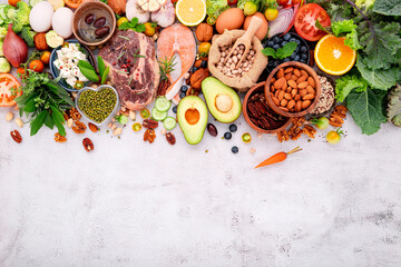 Ketogenic low carbs diet concept. Ingredients for healthy foods selection set up on white concrete background.