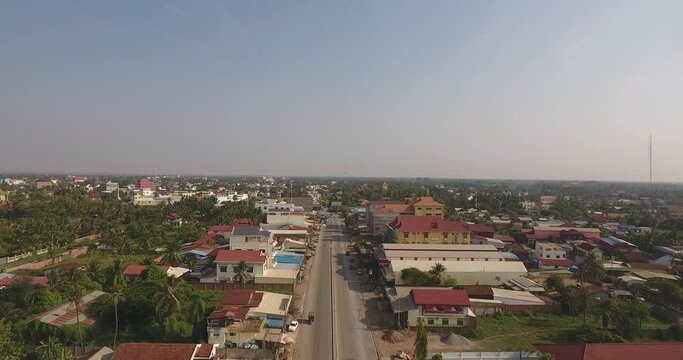 Smooth aerial drone footage moving slowly over asian of town of Battambang in Cambodia 