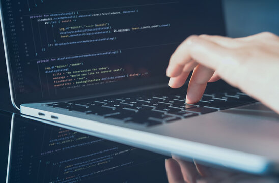 Software technology development concept. Woman programmer, software engineer coding computer script on laptop