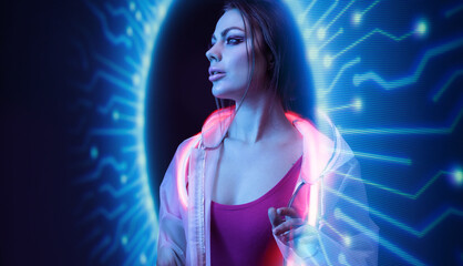 Beautiful woman in futuristic costume on dark background. Girl in glasses of virtual reality. Augmented reality game, future technology, AI concept. Holographic interface to display data.