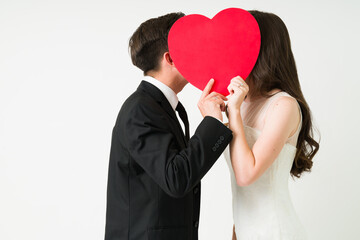 Bride and groom kissing at their wedding