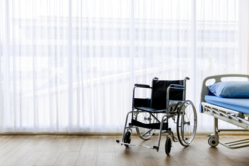 Empty wheelchair and hospital bed waiting for patient services in the hospital - Powered by Adobe