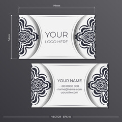 Business card template in white with black luxurious patterns. Vector Ready to print business card design with monogram ornament.