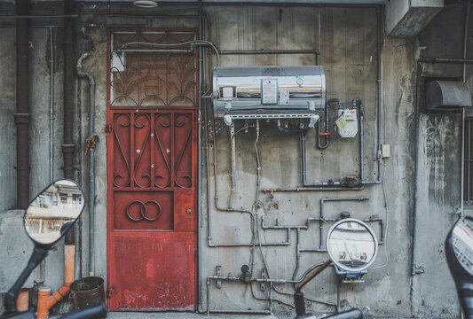 Old house with a red door and the complicated pipe - Taiwan