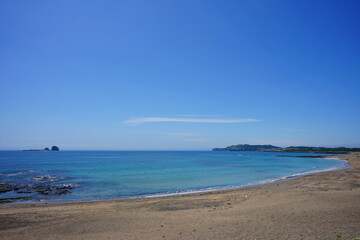a beautiful seascape with a distant island
