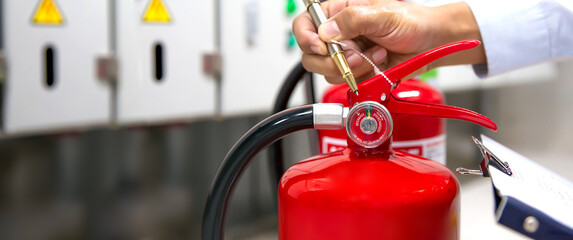 Fire extinguisher, Engineer inspection and checking pressure gauge level of fire extinguisher tank...