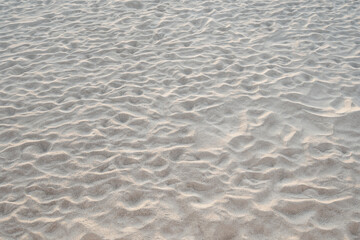 Detail of texture sand in tropical island Summer background and travel design.