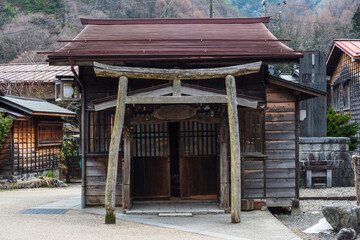wooden temple with torii gate of Narai-juku, Kiso valley