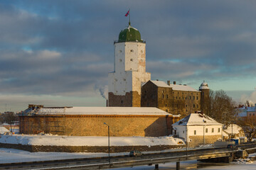 Ancient Vyborg Castle on February evening. Russia