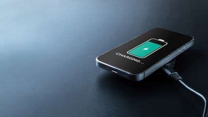 Smartphone charging. Mobile cell phone charge battery from wireless inductive charger. Electronic devices concept.
