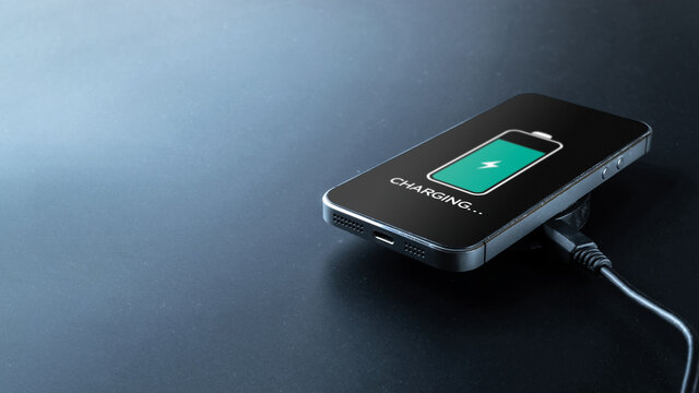Smartphone charging. Mobile cell phone charge battery from wireless inductive charger. Electronic devices concept.