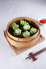 Steamed dumpling dimsum in bamboo steamer. 
