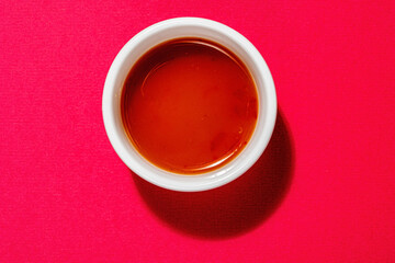 hot sauce on the red background