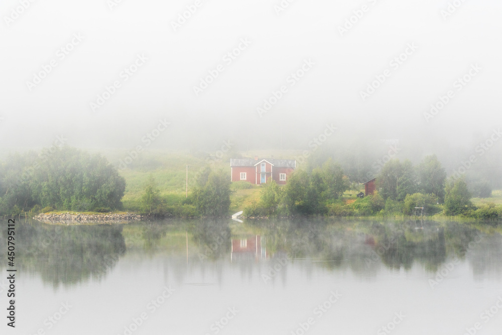 Canvas Prints Morning fog with a house on a beach