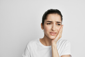 woman with toothache holding face medicine dentistry