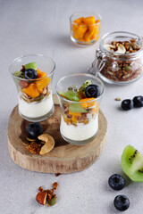 Homemade granola with yogurt and fresh fruits. 
