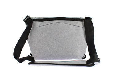 Isolated closeup studio shot of new small casual modern trendy fashionable fabric grey messenger...