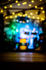 Empty old wooden table in an old restaurant at night as a background