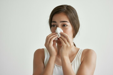 woman in white tank top handkerchief runny nose health problems