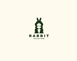 Rabbit and carrot silhouette logo design