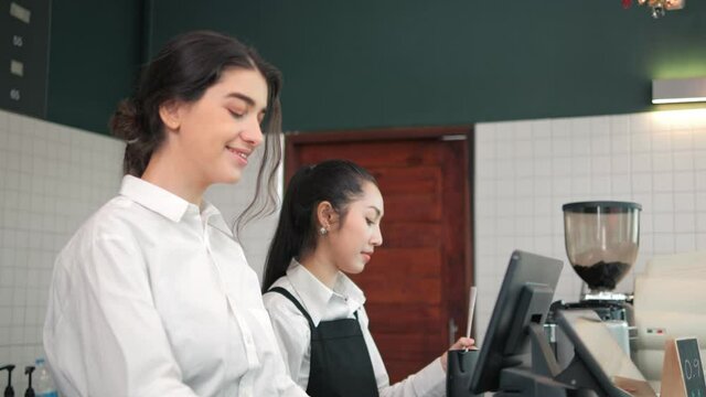 Seller accept payment scanning QR code by smartphone in coffee shop. Digital lifestyle concept