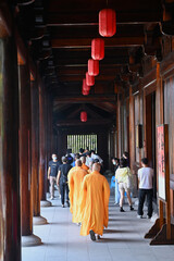 Prayer procession of monks in the local buddhist temple