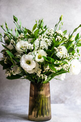 Beautiful white eustoma flowers in bouquet