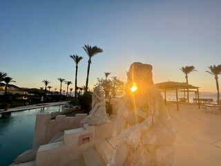 sunrise with statue