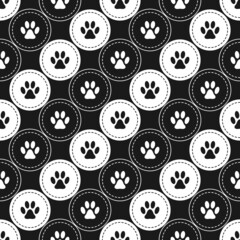 Seamless pattern background with footprints of home pet in circles, diagonal direction. Black and white. Vector.