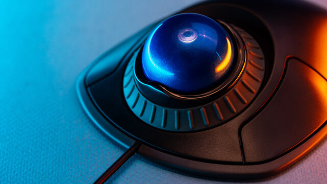 close-up Trackball Computer Mouse on a black background. Control Device with Scroll Wheel