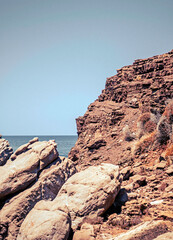 Rocky Spanish coastline and Shore. Sharp coastline rocks and formations on a hot Spanish day.