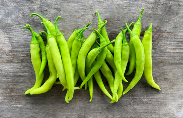Banana Pepper isolated against a wood background