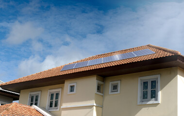 Solar panels or photovoltaic plant installing on the roof of house with blue sky background. Solar cell system is a technology that lowering the power and is environmentally friendly.