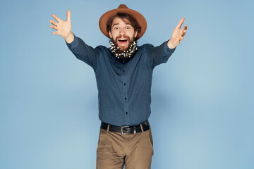 handsome man in hat wearing shirt flowers in beard isolated background