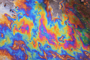 Fototapeta na wymiar multicolored spot gasoline abstract background, abstract oil spill on water