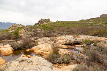Fototapeta na wymiar Water Pools on Top of the Waterfall in the Waterval Nature Reserve near Tulbagh in the Western Cape of South Africa