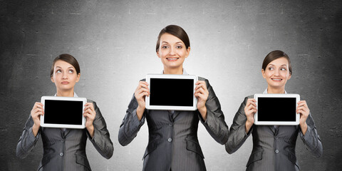 Fototapeta na wymiar business women demonstrates a tablet. concept of choice