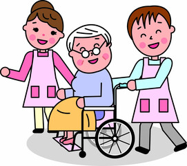 高齢女性が乗る車椅子に寄り添う介護の男女