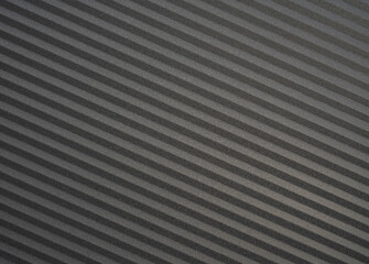 Closeup background with black and gray diagonal stripes, place for text