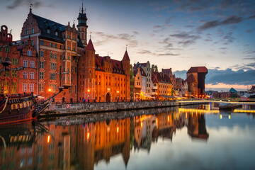 Gdansk with a historic crane at the Motława River at sunset, Poland.
