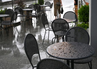 Tables and chairs of a street cafe
