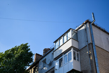Fototapeta na wymiar City apartments on blue sky background