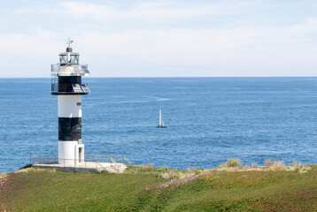Nice view of the lighthouse of the town of Ribadeo during the day, as one of the most touristic natural environments of Gallicia.