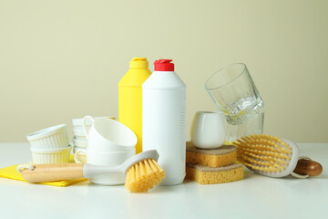 Concept of different Dishwashing detergent accessories on white table