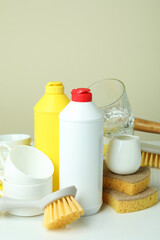Concept of different Dishwashing detergent accessories on white table
