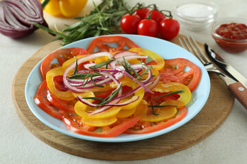 Concept of tasty food with tomato carpaccio on white textured table