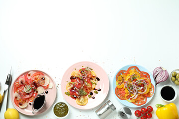 Concept of tasty food with tomato carpaccio on white background