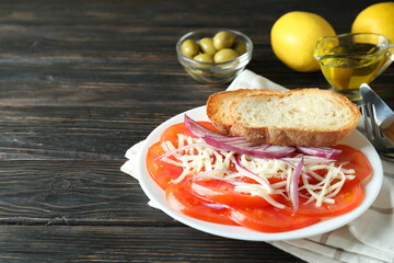 Concept of tasty food with tomato carpaccio on rustic wooden table