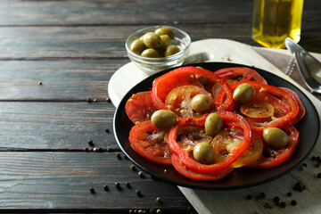 Concept of tasty food with tomato carpaccio on rustic wooden table