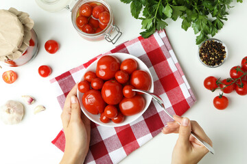 Concept of pickled vegetables with tomatoes on white table